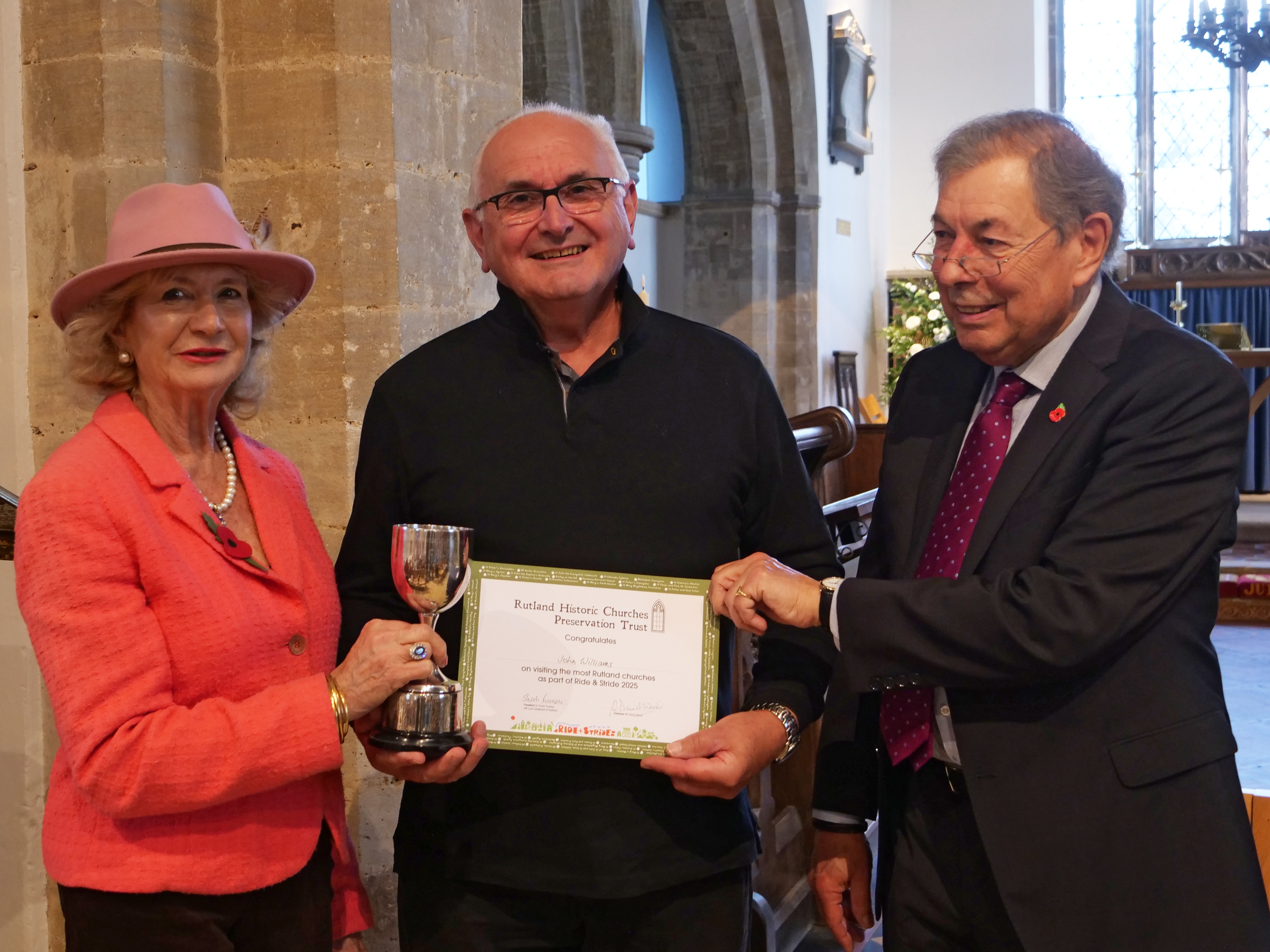 John Williams receiving the cup for cycling to 52 churches